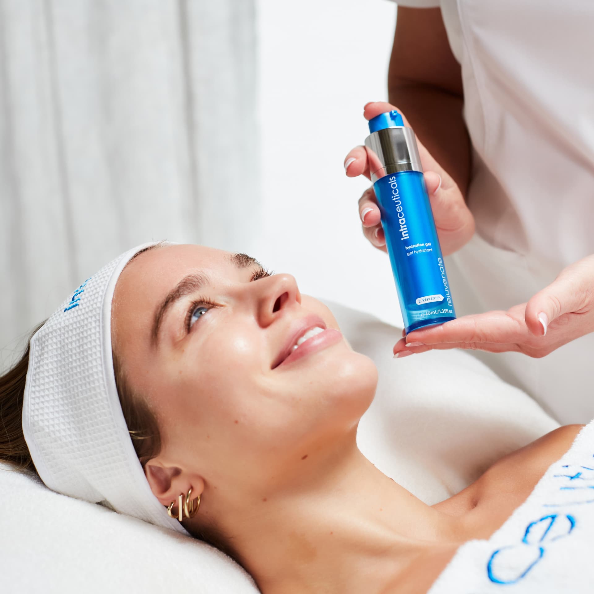 Therapist applying Intraceuticals Rejuvenate hydration gel during a Hydra Beauty facial